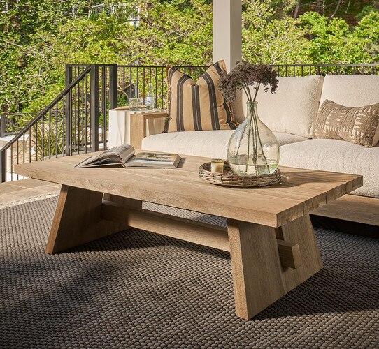 Wood rectangle cocktail table in an outdoor patio setting