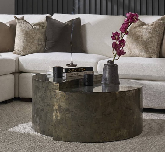 Circular modern metal coffee table with an elevated half