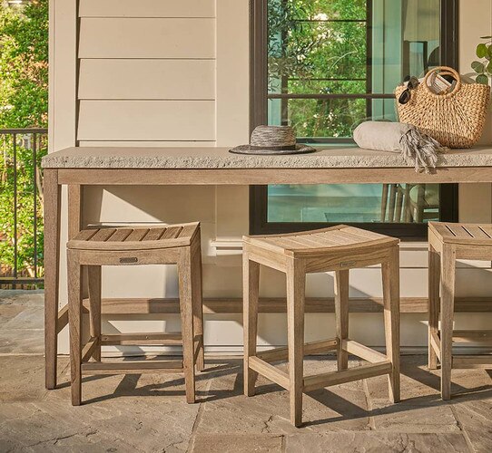 Wood bench and table outside of a window