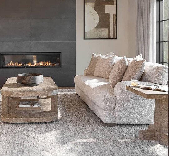 Modern living room with a wood coffee table and white sofa