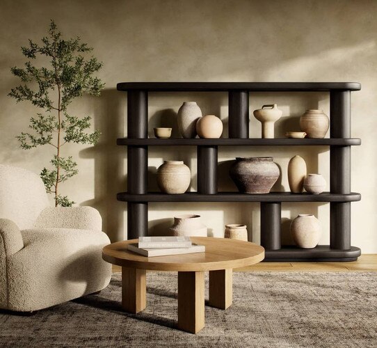 Modern black shelf holding ceramic in front of a wood coffee table