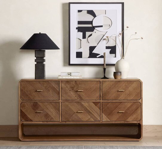 Six dresser dresser holding a lamp and vases