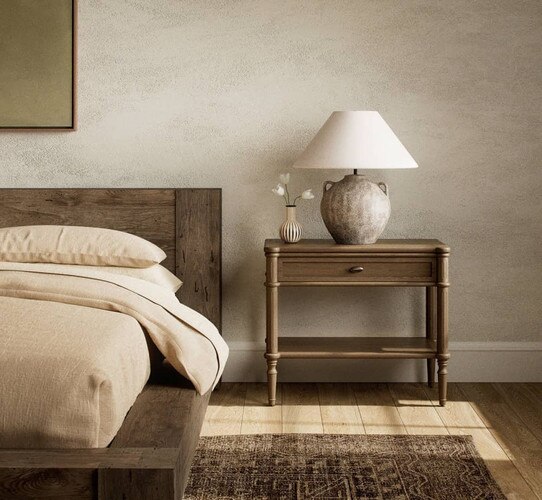 Traditional wood nightstand with spindle legs holding a ceramic lamp