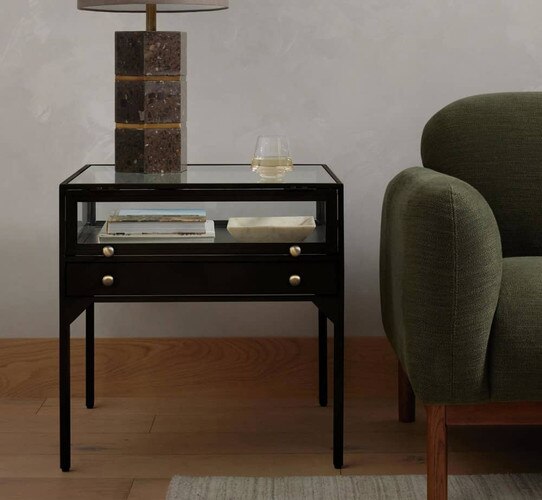 Glass and wood side table with an open glass drawer