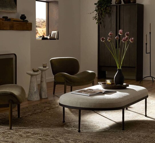 Living room with green linen chairs and a coffee table