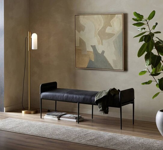 Leather bench under a neutral abstract painting