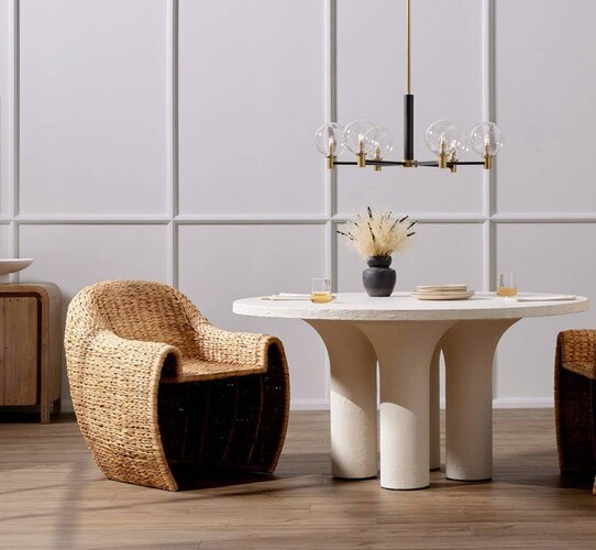 Wicker dining chair beside a white dining table