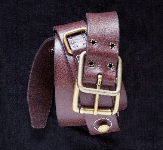 Brown leather belt with brass buckle