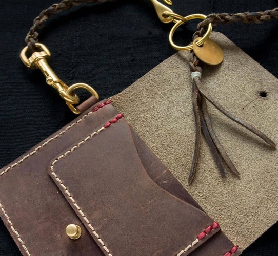 Leather wallet with brass accents