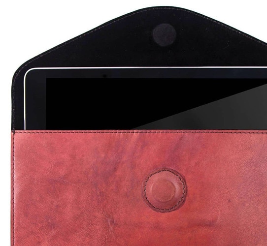 Red leather ipad case with an ipad in it