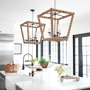 wooden pendant lights above a white marble kitchen island