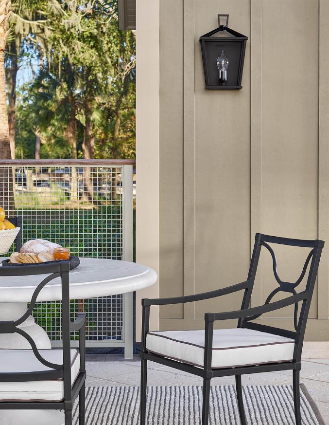 metal chair with white cushion on a patio