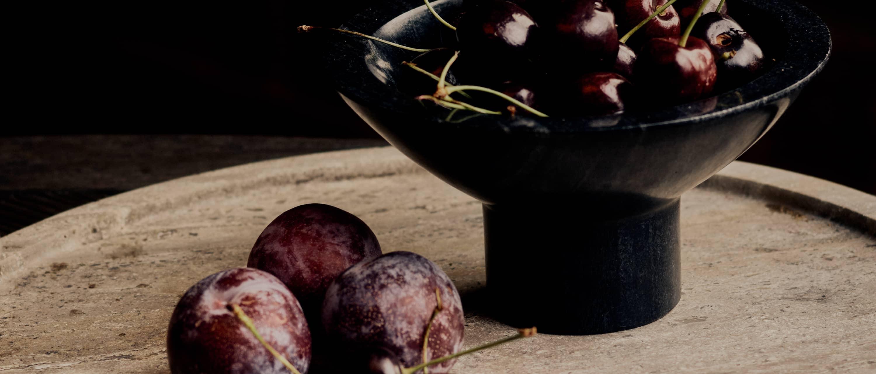 black ceramic lamp besides black candles