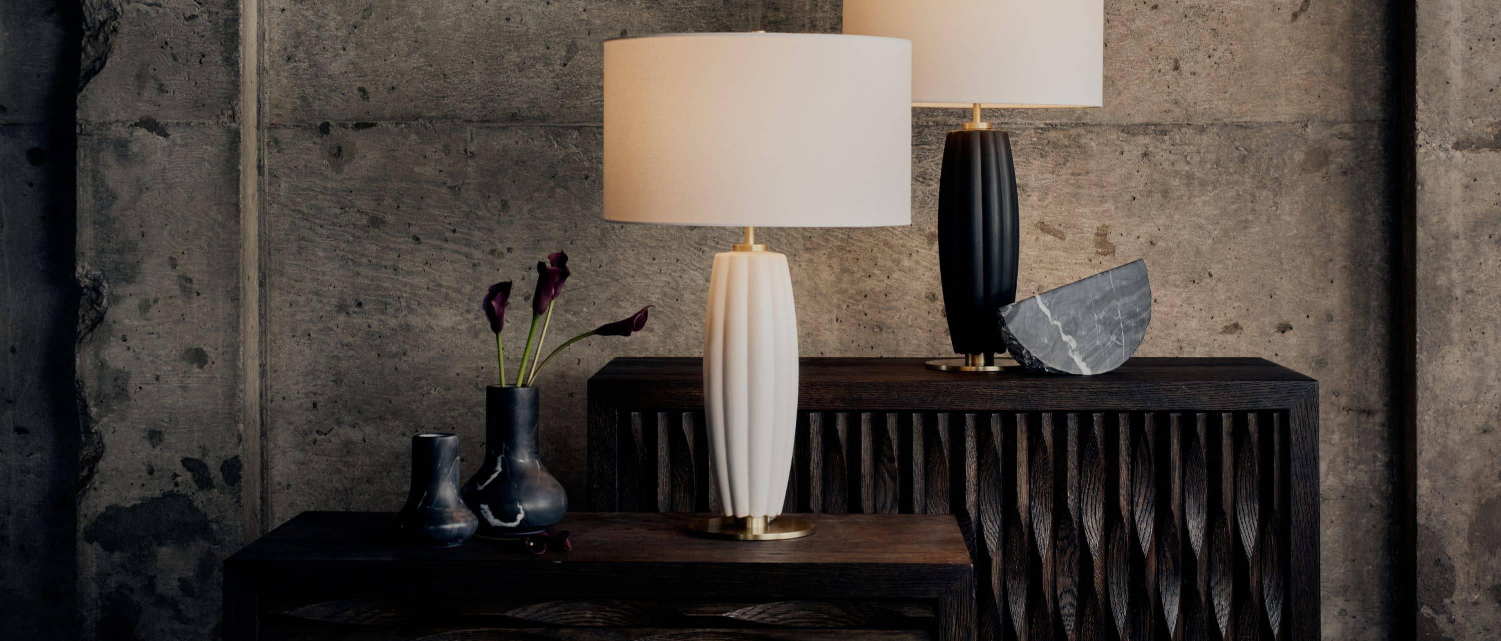 black table lamp beside lit black candles