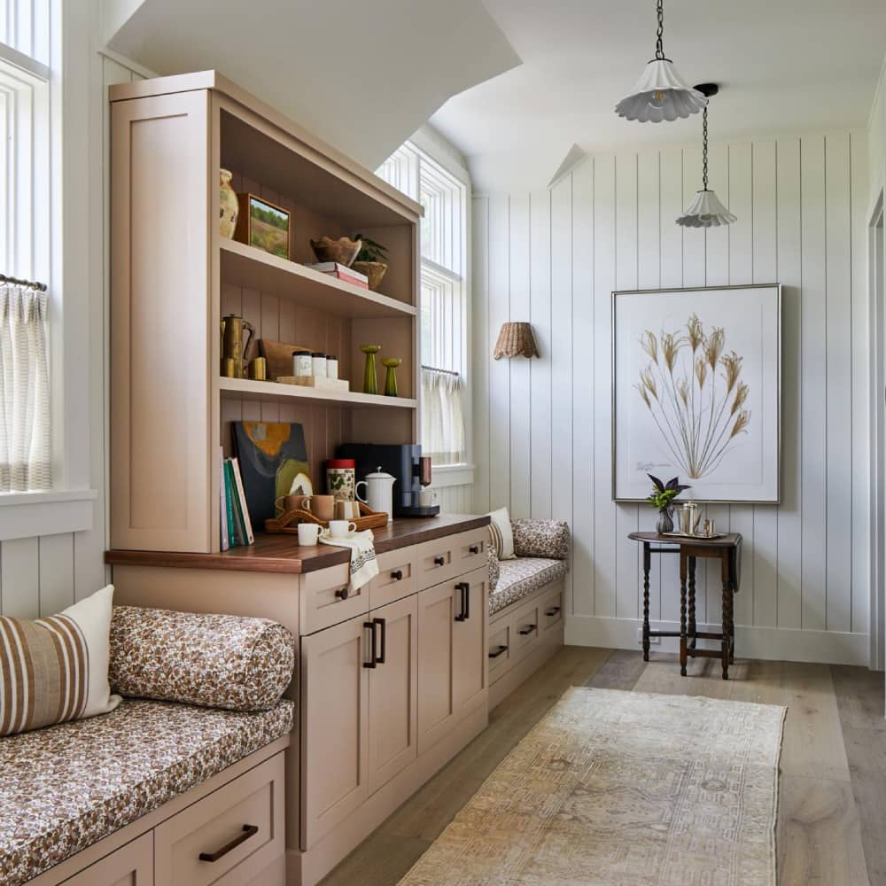 Hallway with shelving benches and a large picture frame at the end