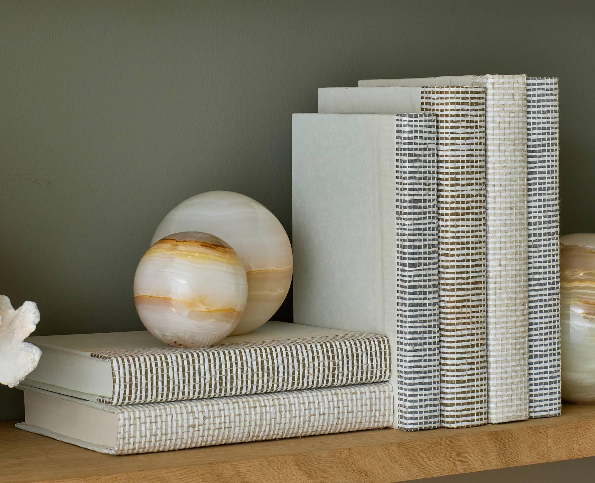 Decorative books holding a jade accent piece